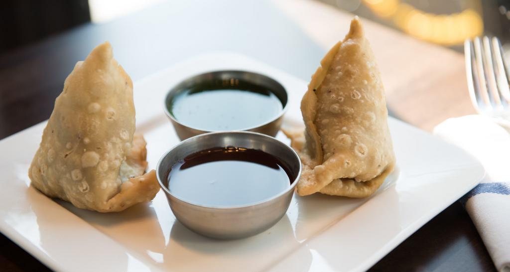 Vegetable Samosa · Delicately spiced potatoes & peas wrapped in a crispy pastry.
