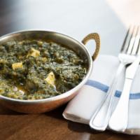 Saag Paneer · Cubes of homemade cheese smothered in freshly ground spinach.