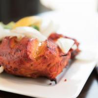 Tandoori Chicken · Chicken marinated in yogurt & spices and broiled in our charcoal clay oven.