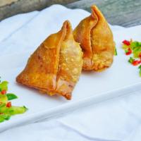Vegetable Samosa · Crispy turnovers with delicately spiced potatoes and green peas, served with mint and tamari...