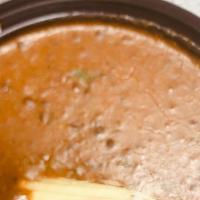 Dal Makhani · A delicious preparation of black lentils simmered overnight with onions, butter and tomatoes...