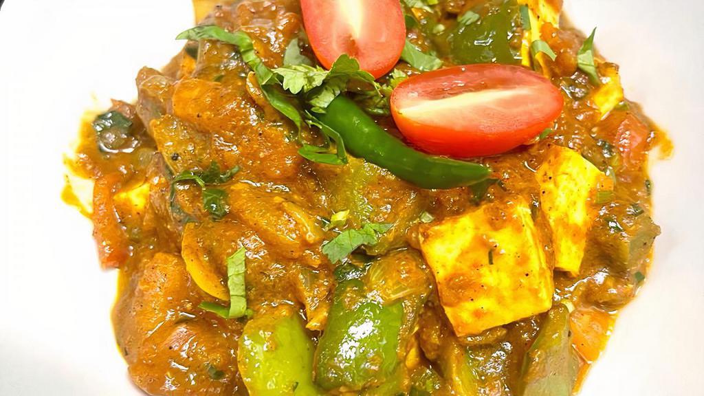 Kadai Paneer · Cottage cheese with tomatoes, onions, and bell peppers, immersed in aromatic sauce.