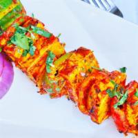Paneer Tikka Sizzler · Cottage cheese infused with herb spice, bell pepper and glazed golden in tandoor.