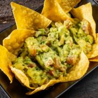 Guacamole Fresco / Fresh Guacamole · Our fresh guacamole serving with homemade Mexican chips.