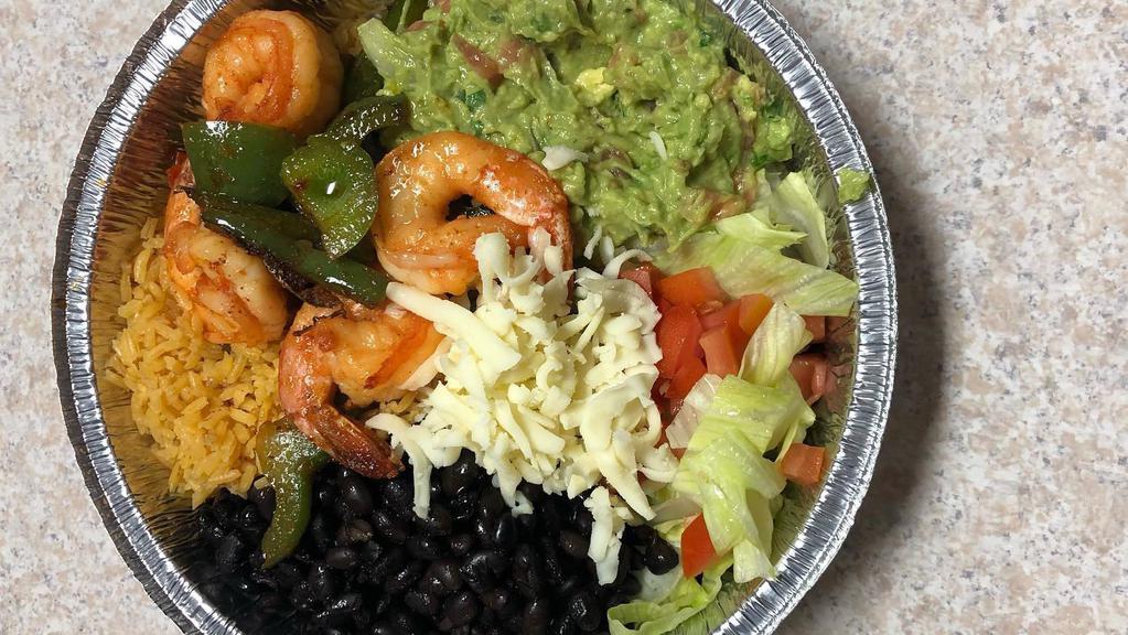 Burrito Bowl · Black whole beans, yellow rice, guacamole, cheese, lettuce, tomato, and the meat of your choice.