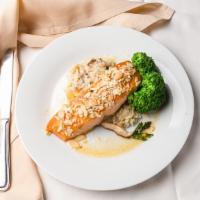 Oven Roasted Salmon · Almond crust, salmon, risotto and seasonal vegetable.