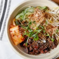 Seoul · Spicy. Grilled steak, kimchi, scallions, bonito flakes, toasted sesame seed, bean sprouts, c...