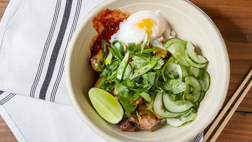 Penang · Grilled chicken, poached egg, cilantro, sambal (spicy), scallions, lime, cucumber salad, and peanut butter curry sauce. (Sauce contains PEANUTS).