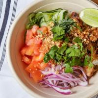Saigon · Grilled chicken, sweet chili lime fish sauce, cucumbers, red onions, tomatoes, Thai basil, P...