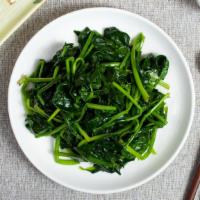 Chinese Broccoli · Fresh broccoli stir fried in a spicy garlic sauce. Garnished with spring onions.