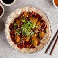Sesame Chicken · Chunks of white meat chicken lightly batter-fried in a sweet spicy sauce topped with sesame ...