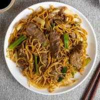 Beef Noodles · Thin vermicelli rice noodles, juicy beef, and seasonal vegetables cooked with house sauce.