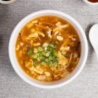 Hot & Sour Soup · Bamboo shoots, soy sauce, chili garlic, mushrooms in a spicy and sour blend.