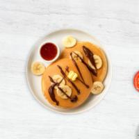 Not Your Nutella Banana Pancakes · Fluffy banana nutella pancakes cooked with care and love served with butter and maple syrup....