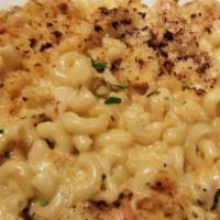 Lobster Mac & Cheese · Prepared with fresh lobster meat, cooked in a three cheese sauce, then baked with crispy pan...
