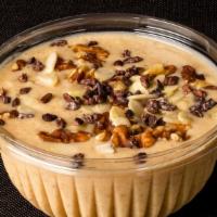 Banana Bowl · Frozen bananas whipped to a custard topped with shaved almonds, walnuts and cacao nibs
