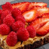 Peanut Butter Toast · Peanut butter topped with raspberries and strawberries.