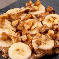 Almond Butter Toast · Almond butter, sliced bananas topped with chopped walnuts.