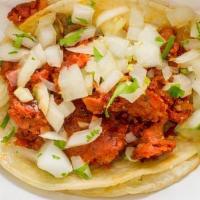 Chorizo Taco · Milan brand chorizo, garnished with onions and cilantro. Includes Avocado Tomatillo and Chil...