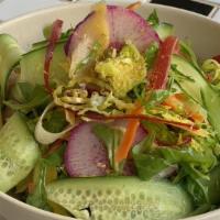 Pretty Raw Salad · arugula, brussels sprouts, cucumber, celery, rainbow carrots, watermelon radish, chamomile b...