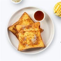 French Toast Kisses · Fresh bread battered in egg, milk, and cinnamon cooked until spongy and golden brown. Topped...