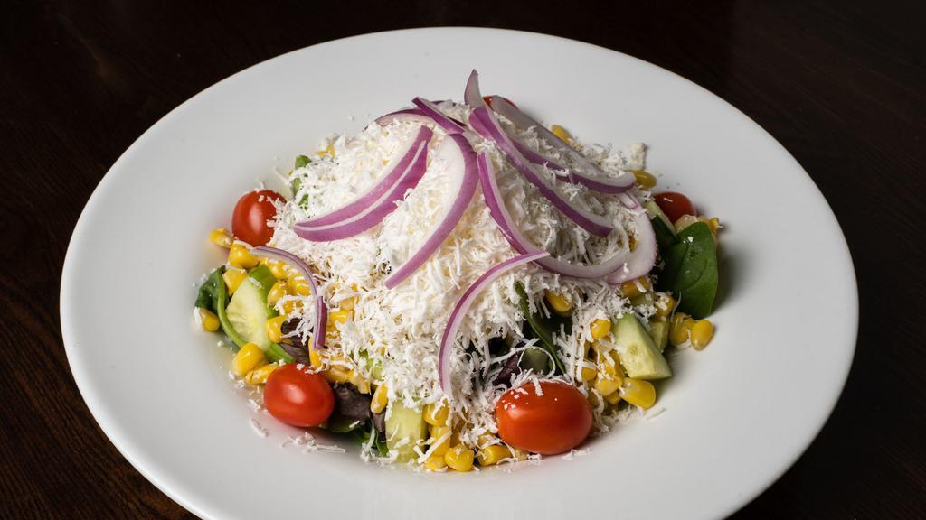 Mediterranean Salad · Fresh tomatoes, lettuce, cucumber, corn, red onion topped with
feta cheese mixed with olive oil, lemon juice and garlic sauce.