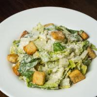 Caesar Salad · Romaine lettuce blended with Caesar dressing and croutons topped with parmesan cheese.