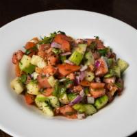 Shepherd Salad · Tomatoes, cucumbers, pomegranate molasses, green pepper.
