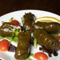 Stuffed Grape Leaves (5 Pcs) · Vine leaves stuffed with rice, currants, onions and herbs