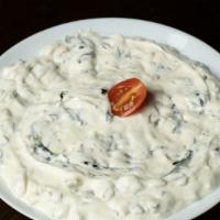 Spinach Tarator · Fresh spinach sauteed with white onions, garlic, thick homemade yogurt, walnut and olive oil.