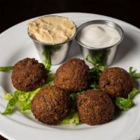 Falafel Plate (5 Pcs) · Deep fried chickpeas and vegetables, blended with Middle Eastern spices and tahini sauce on ...