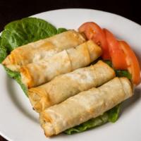 Sigara Boregi (4 Pcs) · Pan fried phyllo scrolls stuffed with feta cheese and spinach.