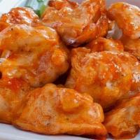 Buffalo Wings (8 Pcs) · Served with blue cheese and celery.