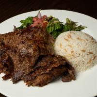 Lamb Gyro  · Layers of marinated lamb wrapped around the vertical split and grilled
in front of charcoal ...