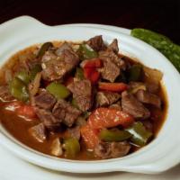 Lamb Sautée · Chunks of lamb sauteed with onions, mushrooms,green peppers, tomatoes,oregano. Served with r...