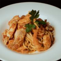 Seafood Linguini · Shrimp, salmon, calamari and tilapia served with marinara sauce topped with parmesan cheese