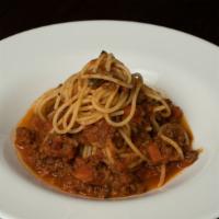 Spaghetti Bolognese · Traditional beef meat sauce and parmesan cheese on the top