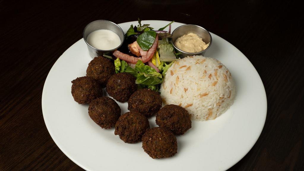 Dinner Falafel Plate (8 Pcs) · Deep fried chickpeas and vegetables, blended with Middle Eastern spices and tahini sauce on the side served with rice,hummus and house salad.