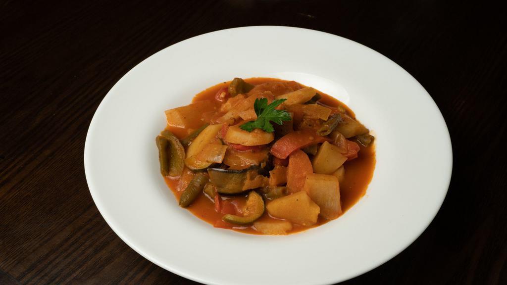 Mixed Vegetable Casserole · Turkish seasoned zucchinis, carrots, onions, tomatoes, string beans, potatoes, eggplants, sliced fresh garlics, green and red peppers cooked in olive oil and tomato sauce served with rice.