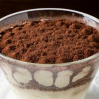 Tiramisu · Layers of sponge cake soaked in coffee with powdered chocolate and mascarpone cheese.