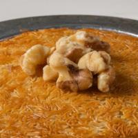 Kunefe · Shredded dough with special unsalted cheese with honey syrup. Topped with walnuts. Served hot