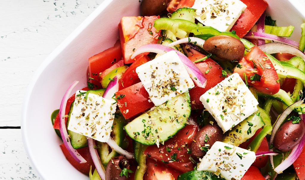Greek Salad · Vegetarian. Vine ripened tomatoes, red onions, green peppers, cucumber, Kalamata olives in 100% virgin Greek olive oil dressing.