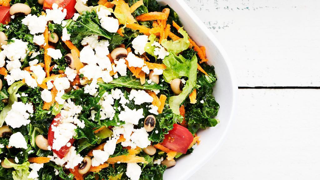 Kale Salad · Vegetarian. Kale, tomatoes, carrots, black eyed peas, feta cheese, GRK herb vinaigrette.