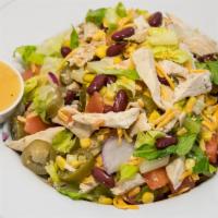 Fiesta Salad · Romaine lettuce, chipotle grilled chicken, tomatoes, red onions, cheddar cheese, jalapeño, b...