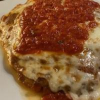 Chicken Parmigiana · Chicken cutlet lightly breaded, and baked with mozzarella, and house made marinara sauce.