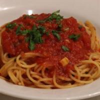 Spaghetti Pasta · With fresh shrimp, crushed tomatoes, chili flakes, garlic, and oil.