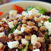 Black Eyed Pea Salad · Arugula and field green blend with black eyed peas, bacon, feta, bell peppers and walnuts.