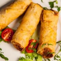 Chicken Cigars · Moroccan style spring rolls stuffed with chicken and herbs.