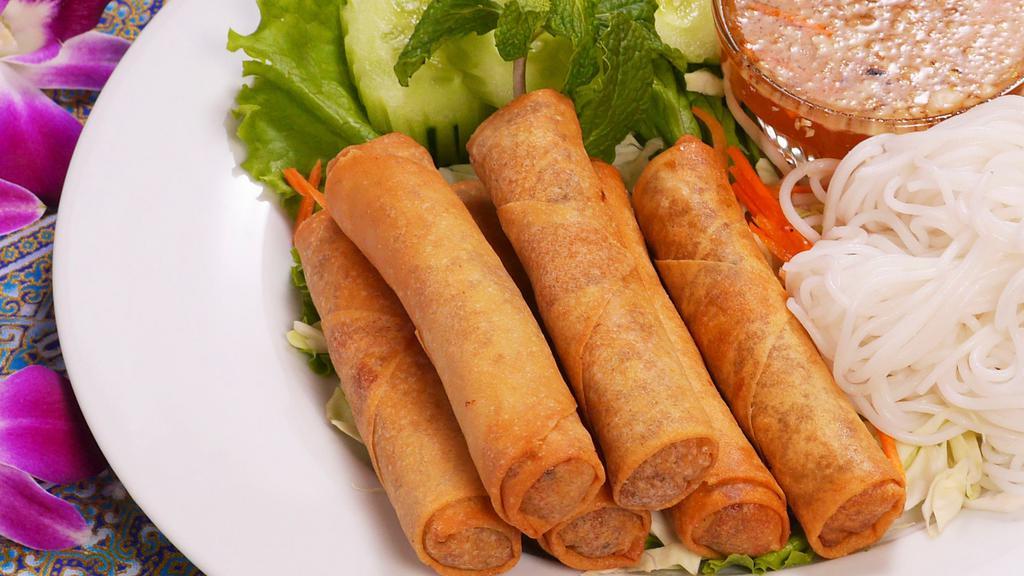 Spring Rolls (6 Pc) · Crispy deep-fried rolls filled with ground pork, onion, black fungus, taro, carrot, and glass noddles, served with sweet and sour sauce, Choice of pork or vegetables.