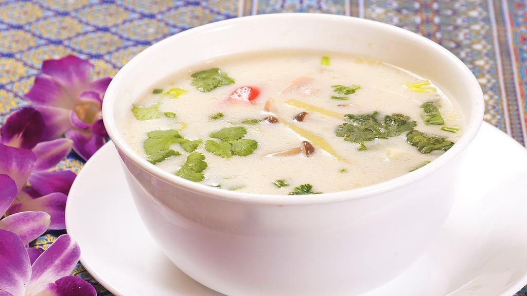 Tom Kha · Coconut ginger soup with lemongrass, galangal, lime leaves, ginger, mushroom, onion, and cilantro.
